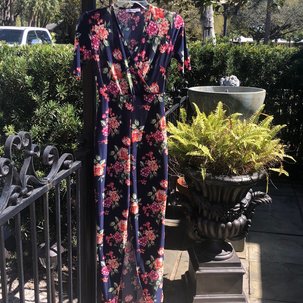 Absolutely lovely and a real head turner.  V neck maxi with knee high split.